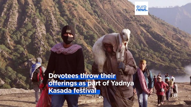 Hindus in Indonesia throw ritual offerings to gods into active volcano