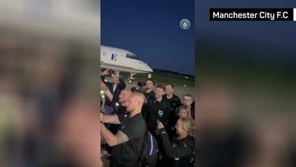 Elton John serenaded by Manchester City players at airport