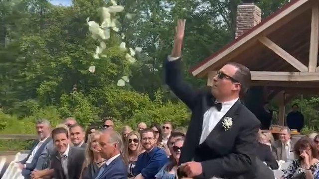 Hilarious Groomsman makes amazing entrance by throwing flowers everywhere!