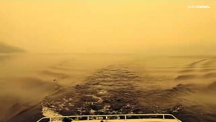 شاهد: بنايات مانهاتن ونيويورك الشاهقة وبحيرتها تختفي خلف الدخان البرتقالي الخانق بسبب حرائق كندا