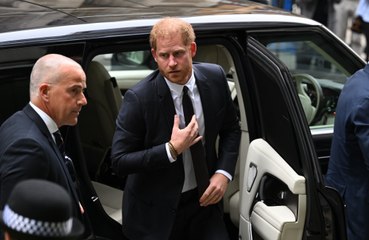 Prince Harry appeared to fight back tears after hours of gruelling questioning on day two of hacking trial