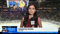 Reporter stiff arms guy trying to get in front of the camera at hockey game