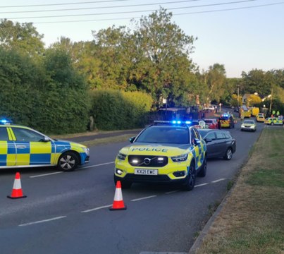 Police tape off road in Northamptonshire village