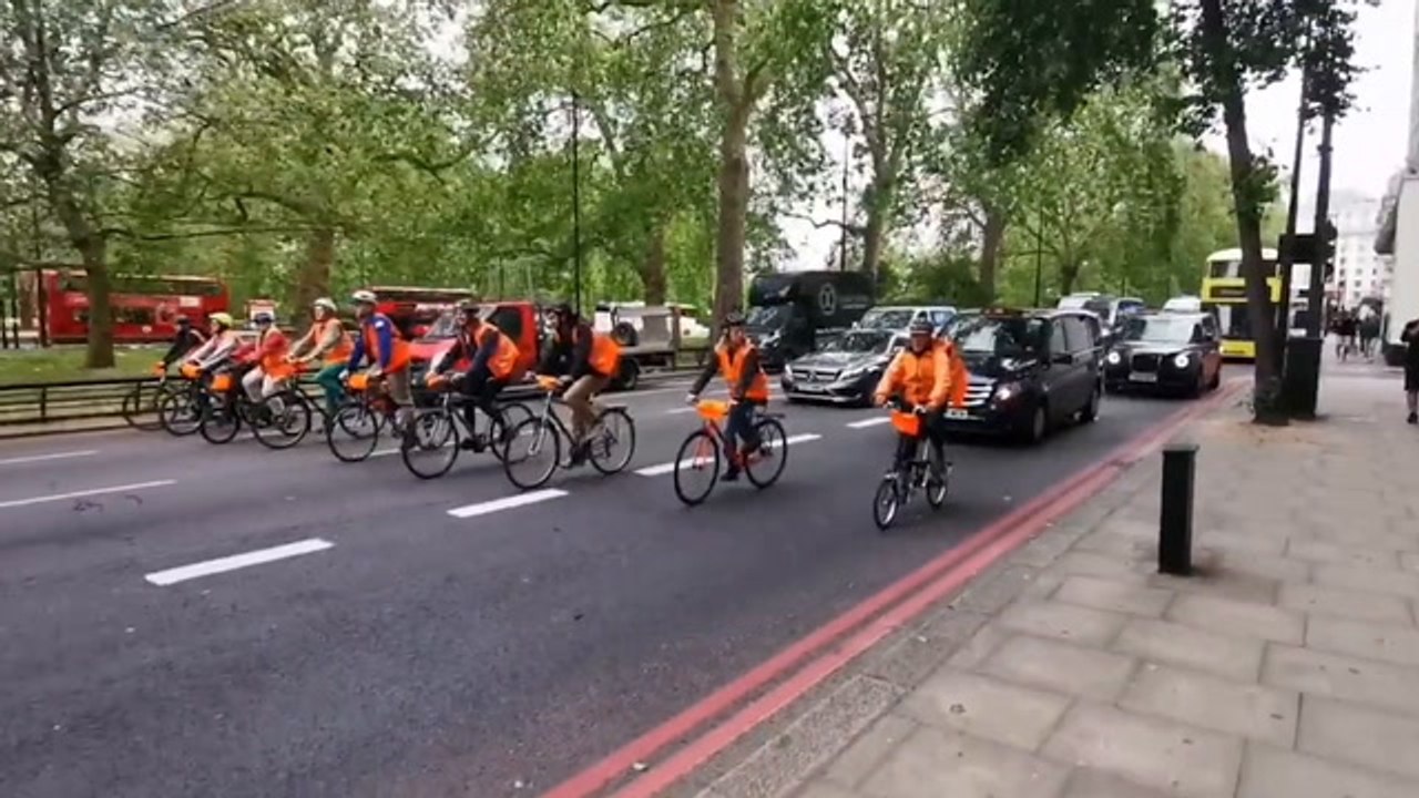 Just Stop Oil protestors slow cycle blocking traffic on Park Lane