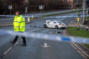 Police have shut key routes in North Leeds after a car hit the Vertu Jaguar car garage.
