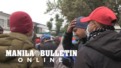 Families of Nepal plane crash victims wait outside hospital for release of bodies