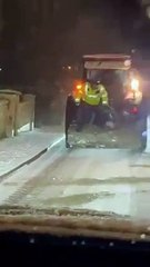 Buncrana Gardai help local farmers distribute salt on slippy roads as snow falls