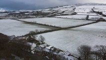 Drone footage of Kirk Michael covered in snow