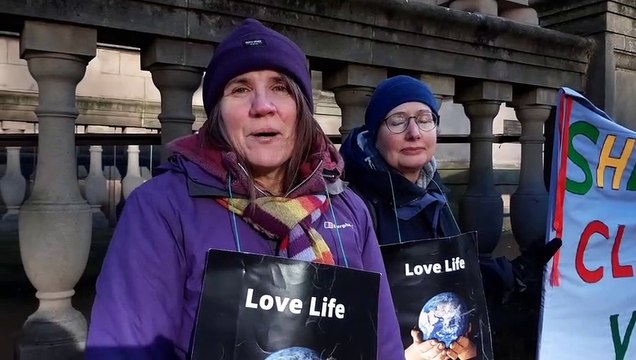 Jenni Crisp from Sheffield Climate Vigil speaking outside Sheffield Town Hall about the city council's progress towards its target of net zero carbon emissions for the city by 2030