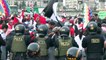 Political protests in Peru as rival groups march through the capital city Lima