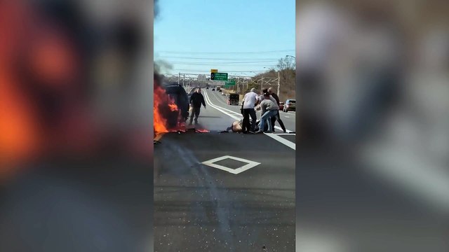 Heroic bystanders stop traffic to rescue 56-year-old woman from fireball after car sets alight on New York highway