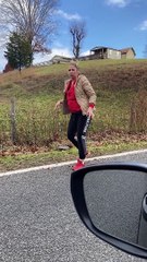 Woman Tries to Help Snapping Turtle off the Road