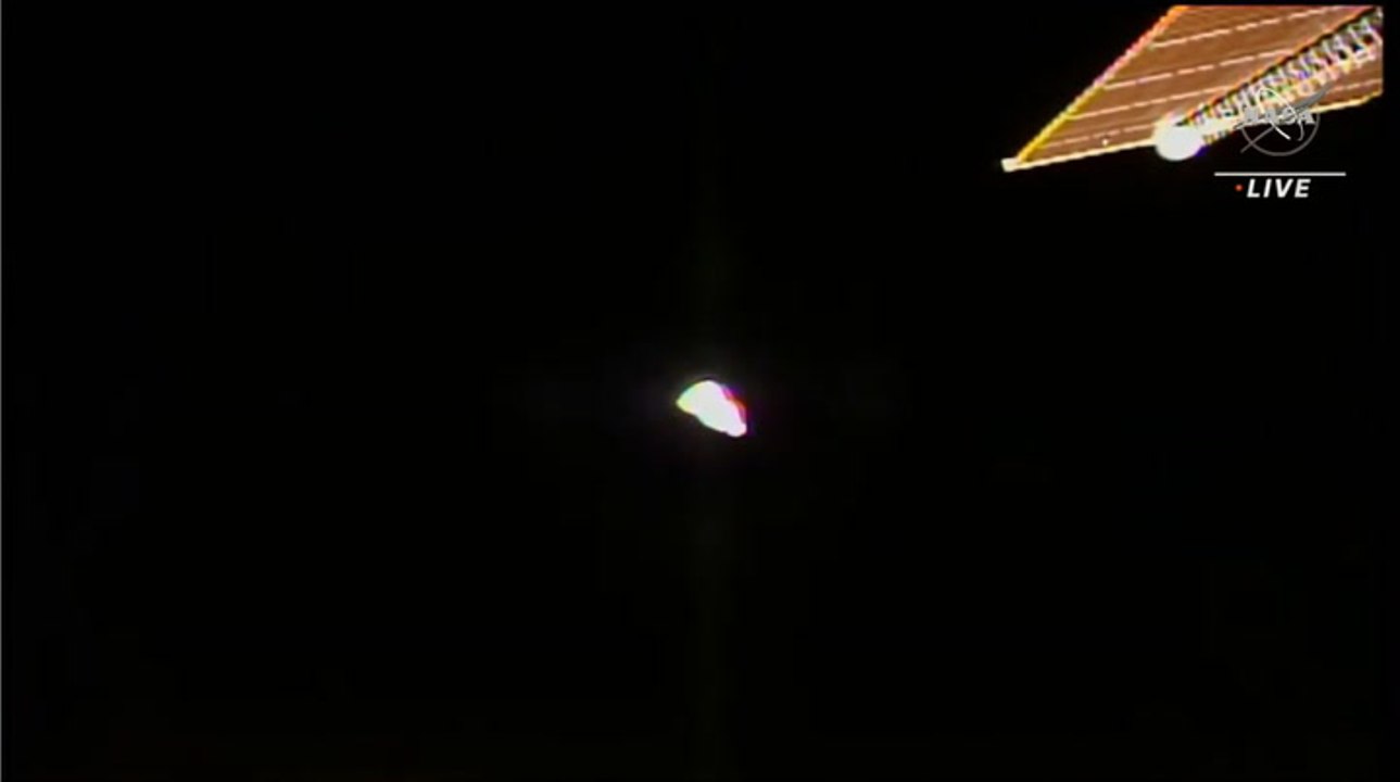 See SpaceX's Dragon Cargo Capsule Move Away From Space Station After Undocking