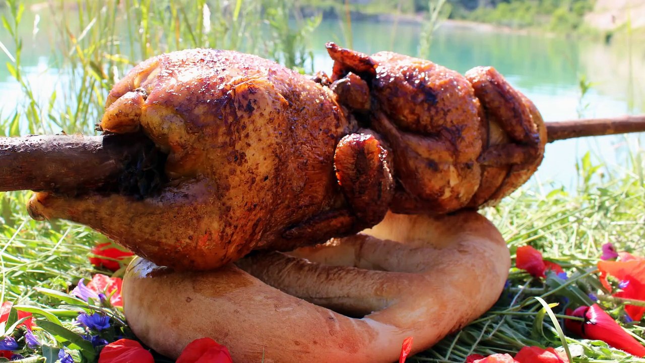 CHICKEN ON A SPIT NEAR THE RIVER