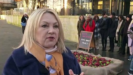 Charity lays 1,071 rotten apples outside New Scotland Yard