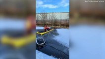 Moment firefighters rescued a dog after it fell into an icy canal while chasing ducks
