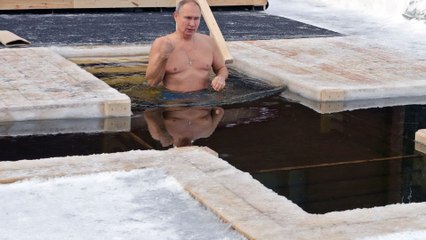 Vladimir Putin ditches the pubilicity during annual dip in freezing water