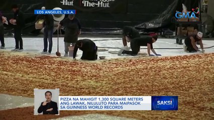 Pizza na mahigit 1,300 square meters ang lawak, niluluto para maipasok sa Guinness World Records | Saksi