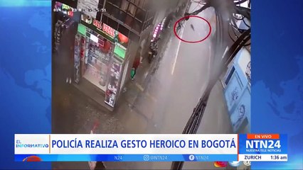 Heroica de reacción de Policia para salvar a una mujer arrastrada por el agua en Bogotá