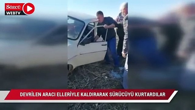 Vatandaşlar devrilen aracı elleriyle kaldırarak sürücüyü kurtardı