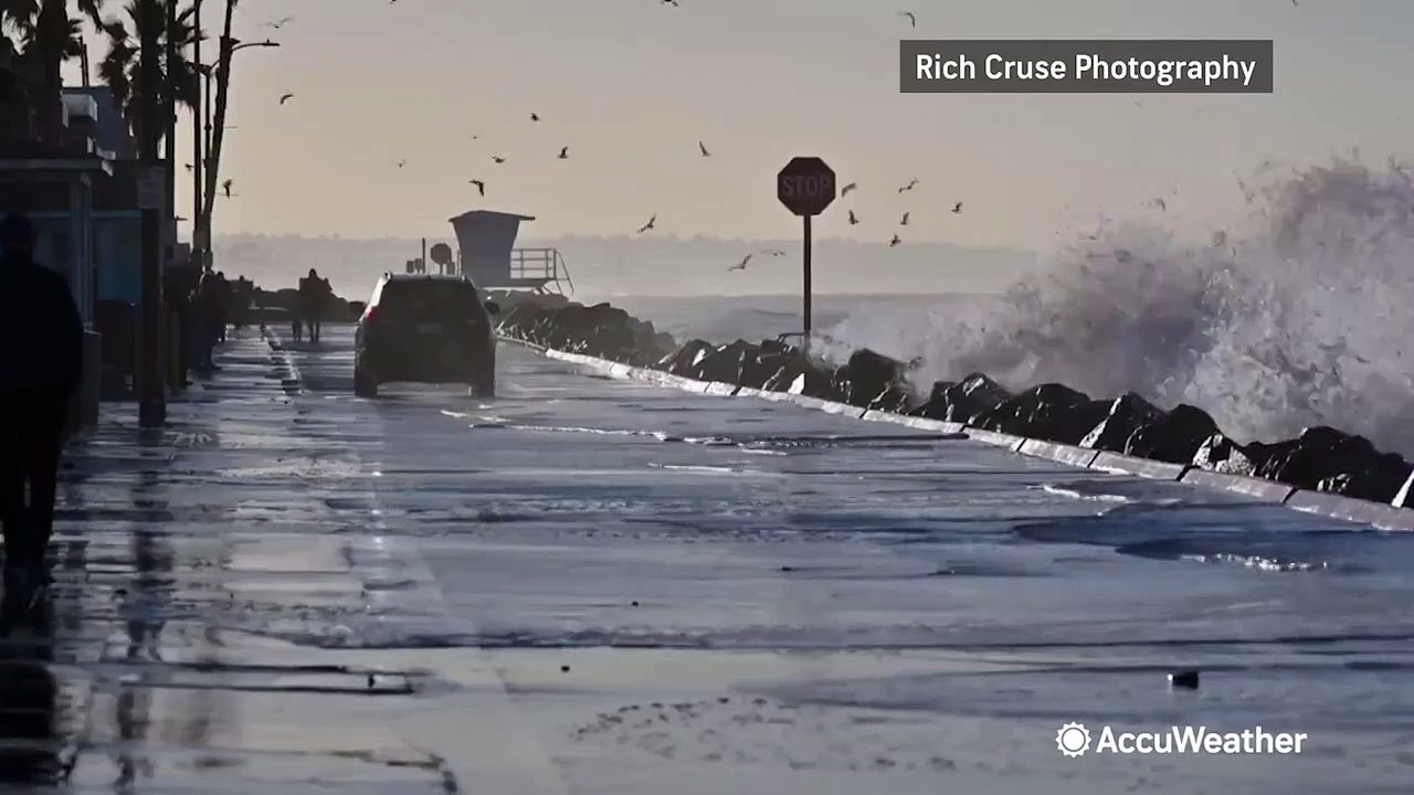 Huge waves crash on road