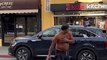 Wild Man Punching and Climbing on Cars Gets Arrested