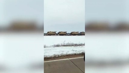 Train seen carrying dozens of tanks in America day before agreement to send infantry to Ukraine