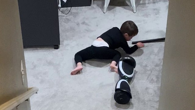 Sporty lad flies off hoverboard while showing mom that he can ride it by himself