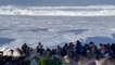 Moment huge wave wipes out spectators at surf contest in Hawaii
