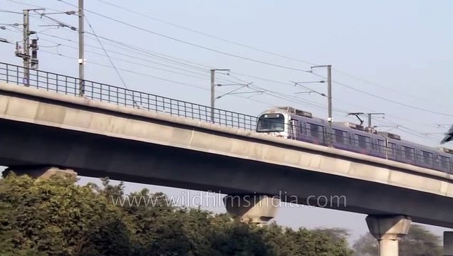 Delhi metro passing _ seen near Nehru Place metro station!