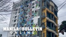 Environmental activist and muralist with fellow artists made a vast mural painting at Quezon City