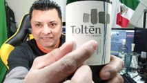 Abriendo una botella de vino tinto tolten by carmen merlot de el valle central de chile