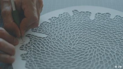 Saving coral reefs with scissor art