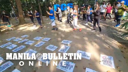 Public schools teachers hold protest by performing a Zumba dance