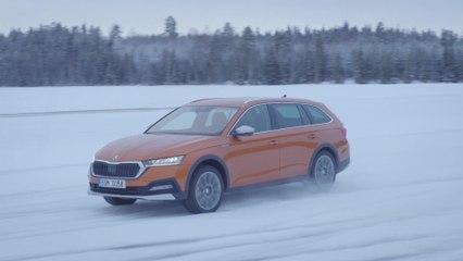 The new Skoda Octavia Scout in Phoenix Orange Driving in the snow