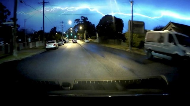Moment huge lightning bolt strikes Sydney sky captured on dashcam