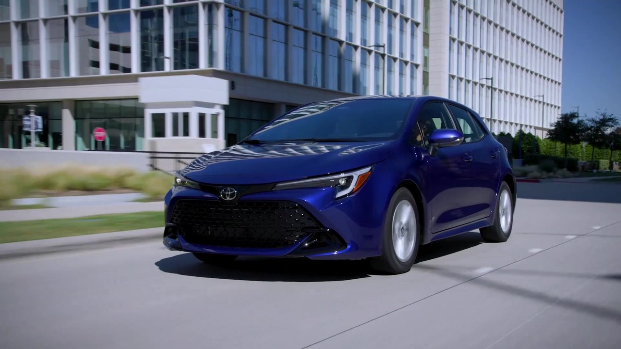 2023 Toyota Corolla SE Hatchback Blue Crush Metallic Driving in the city