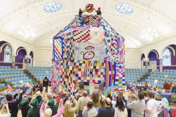 Knitters create UK’s biggest bobble hat using 2 million yards of yarn