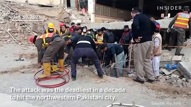 Suicide bomber kills at least 100 people in a heavily fortified mosque in Pakistan