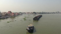 Tugboat and barge at Chao Phraya river Koh Kret Thailand