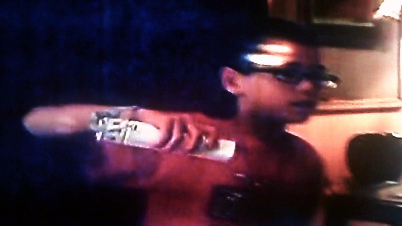 Jonathan playing the wii while Christopher & Anthony watch