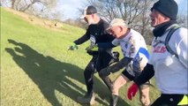 One of Britain's oldest runners crossed the finish line of 15-mile run with fellow jogger holding his hand