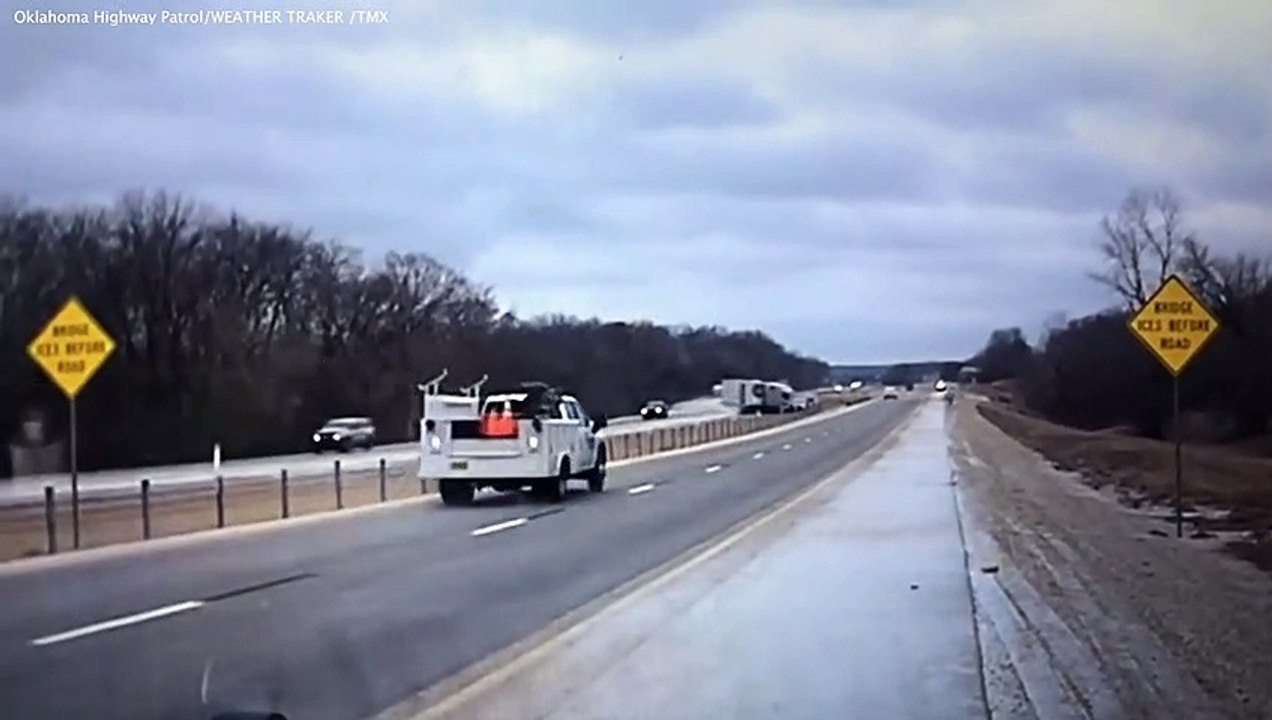 Semi truck loses control in icy conditions and careers into oncoming traffic narrowly avoiding a collision
