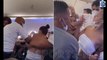 Shocking moment mass brawl between women breaks out on airline jet: Female passengers pull hair, slap each other and even spill out of their clothes as air crew try to calm them down on flight to Brazil
