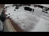 Couple Struggles to Walk Through Driveway Due to Heavy Snow in Dallas, Texas