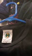 Shirt Has a Missing Person Tag Underneath Main Tag