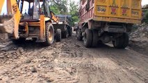 Trucks stuck due to road block on National Highway No. 58