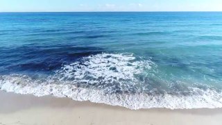 mixkit-waves-coming-to-the-beach-5016-medium