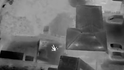 Moment clumsy suspect tumbles over garden fence during on-foot police chase