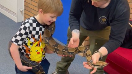 'I just don't wanna get bite' - Boy has priceless reaction to holding HUGE SNAKE for the 1st time